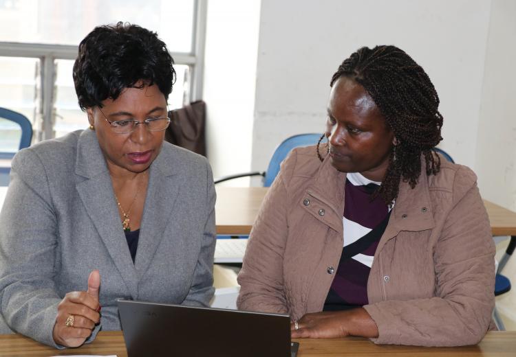 Prof Margaret Kobia and Ayoo Odicoh consult before official opening of the meeting