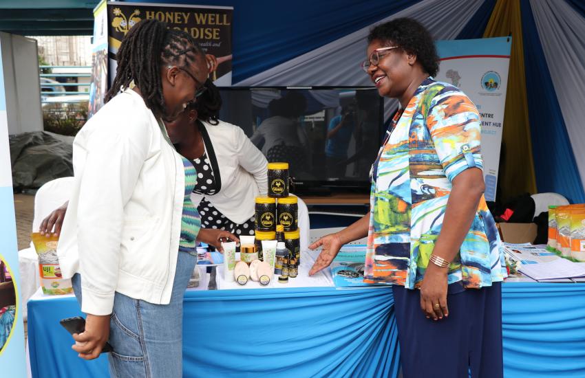 Mrs. Rose Marete and Breanda, a WBI exhibitor at WEE Hub exhibition booth