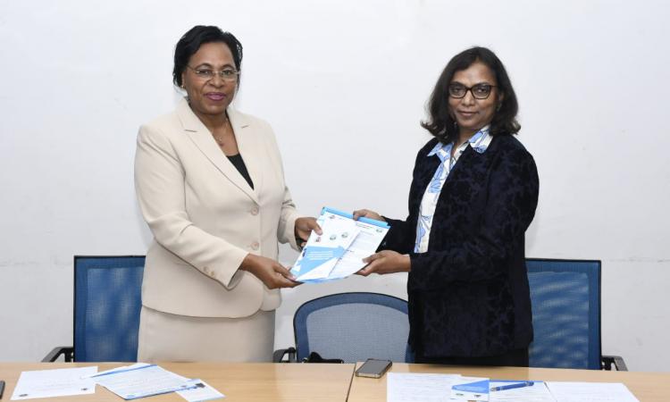 Prof Margaret Kobia presets WEE Hub publications to Dr. Kattamuri