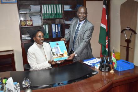 Prof. Mumenya poses for a photo with the outgoing  Dean, Prof. Ayub Gitau
