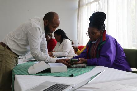 Trainer guides Reseach Assistant during training session