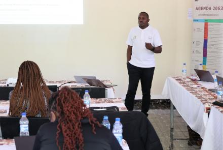 A member of the research team presents team findings